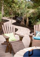 Kick Back:
Angel transferred her signature style to outdoor areas, as in the case of these wooden lounge chairs amped up with throw pillows in fluorescent greens and blues.                                                                                                                                                                          